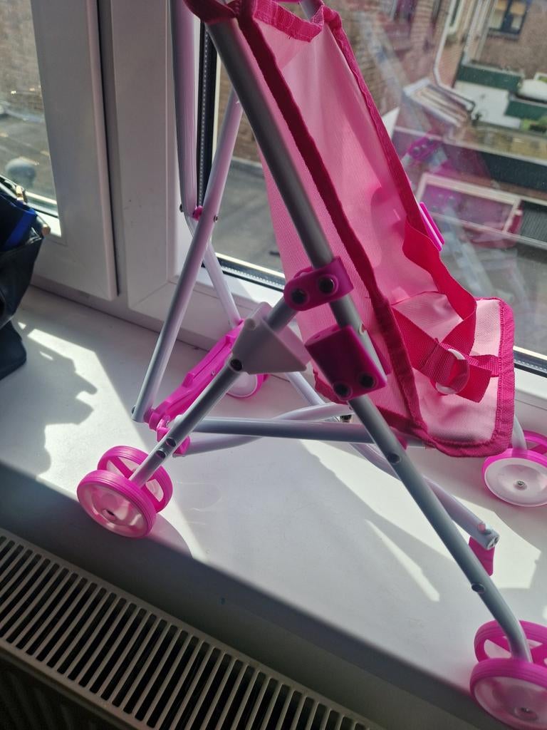 Roze kinderwagen voor poppen, Kinderen en Baby's, Speelgoed | Poppen, Ophalen of Verzenden