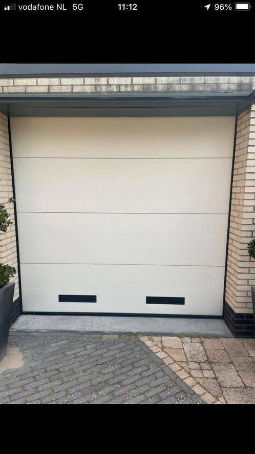 Sectionale Garagedeur geïsoleerd nieuw Novoferm loopwerk, Doe-het-zelf en Verbouw, Deuren en Horren, Gebruikt, Garagedeur, 215 cm of meer