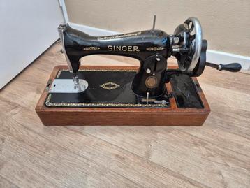 Oude naaimachine Singer beschikbaar voor biedingen