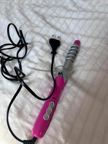 Roze krultang beschikbaar voor biedingen