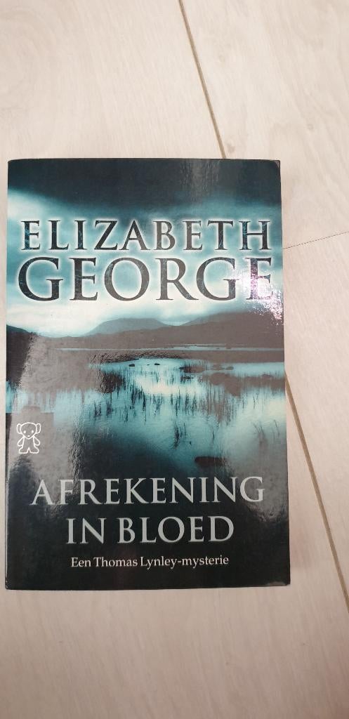 Elizabeth George Afrekening in bloed, Ophalen of Verzenden, Zo goed als nieuw, Elizabeth George