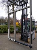 Hardhouten voordeur met zij bovenlicht