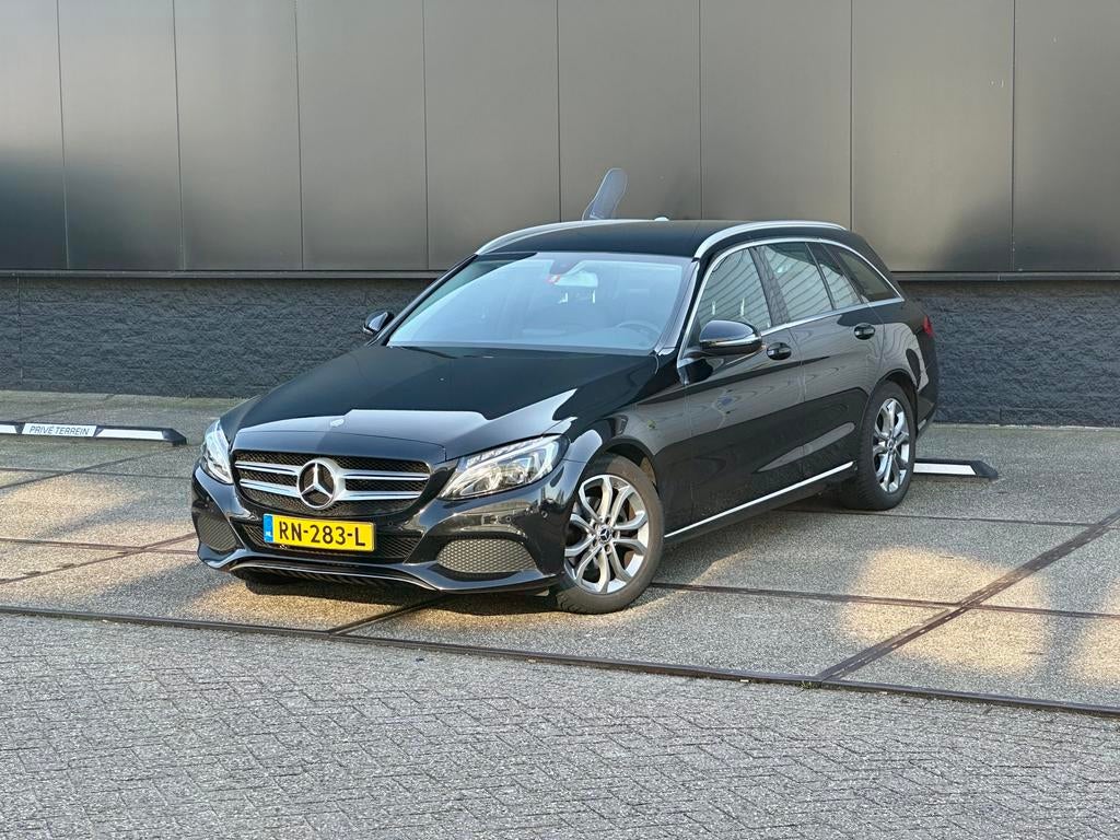 Mercedes-Benz C180 Estate | Dakkoffer | 2 sets banden |Zwart, Automaat, Achterwielaandrijving, 1800 kg, Zwart