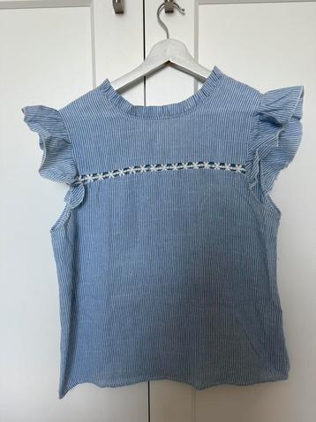 Blauwe blouse beschikbaar voor biedingen