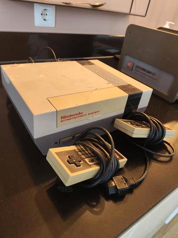 Nintendo NES met 10 spellen, joystick en game genie beschikbaar voor biedingen