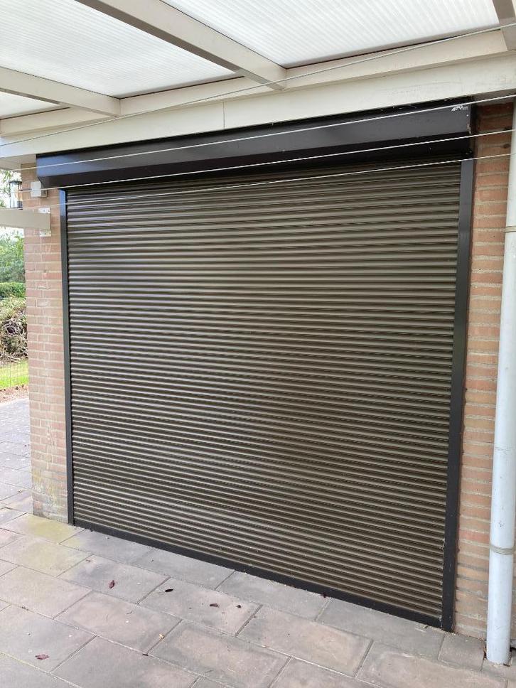 rolluiken, Doe-het-zelf en Verbouw, Rolluiken, Gebruikt, 100 tot 150 cm, 100 tot 150 cm, Bruin, Elektrische bediening, Ophalen