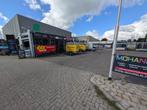 Carwash wasstraat kettingbaan bij tankstation woonboulevard