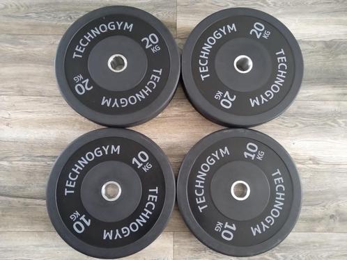 Technogym Bumper Plates 50mm (2x10kg - 2x20kg - 2x25kg), Sport en Fitness, Fitnessmaterialen, Nieuw, Halterschijven, Armen, Benen