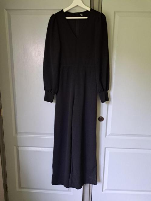Nieuw: zwarte jumpsuit met lange mouwen, maat M., Kleding | Dames, Jumpsuits, Zo goed als nieuw, Maat 38/40 (M), Zwart, Ophalen of Verzenden
