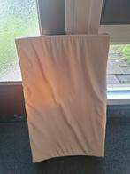 Isi aankleedkussen, Ophalen