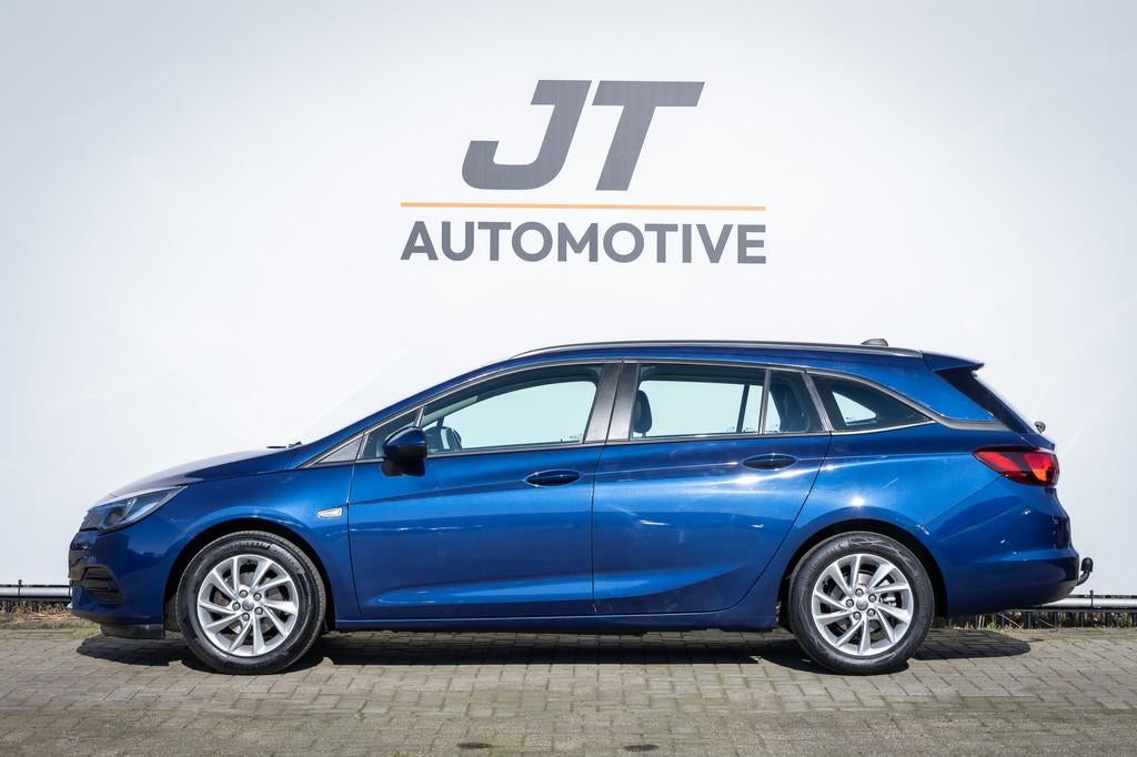 Opel Astra SPORTS TOURER 1.2 Edition Parkeersensoren | Trekh, Auto's, Overige Auto's, Euro 6, 1199 cc, Blauw, 23 km/l