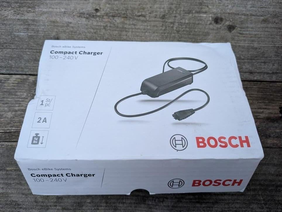Bosch Compact Charger 2A E-bike Acculader 100-240V, Fietsen en Brommers, Fietsaccessoires | Fietsaccu's, Ophalen of Verzenden