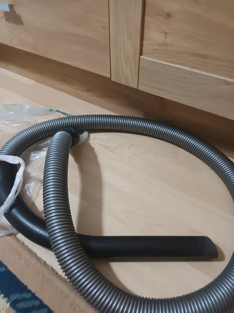 Stofzuigerslang Bosch., Ophalen