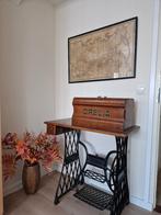 Antieke naaimachine, Ophalen