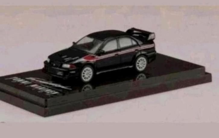 Mitsubishi Lancer Evolution VI 1:64. Nieuw in verpakking, Hobby en Vrije tijd, Modelauto's | Overige schalen, Nieuw, Auto, Ophalen of Verzenden