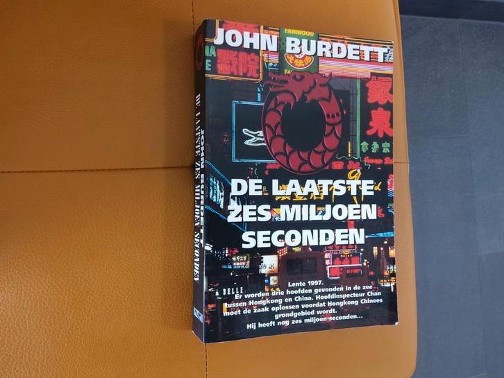 De Laatste Zes Miljoen Seconden - John Burdett, Boeken, Thrillers, Gelezen, Nederland, Ophalen of Verzenden