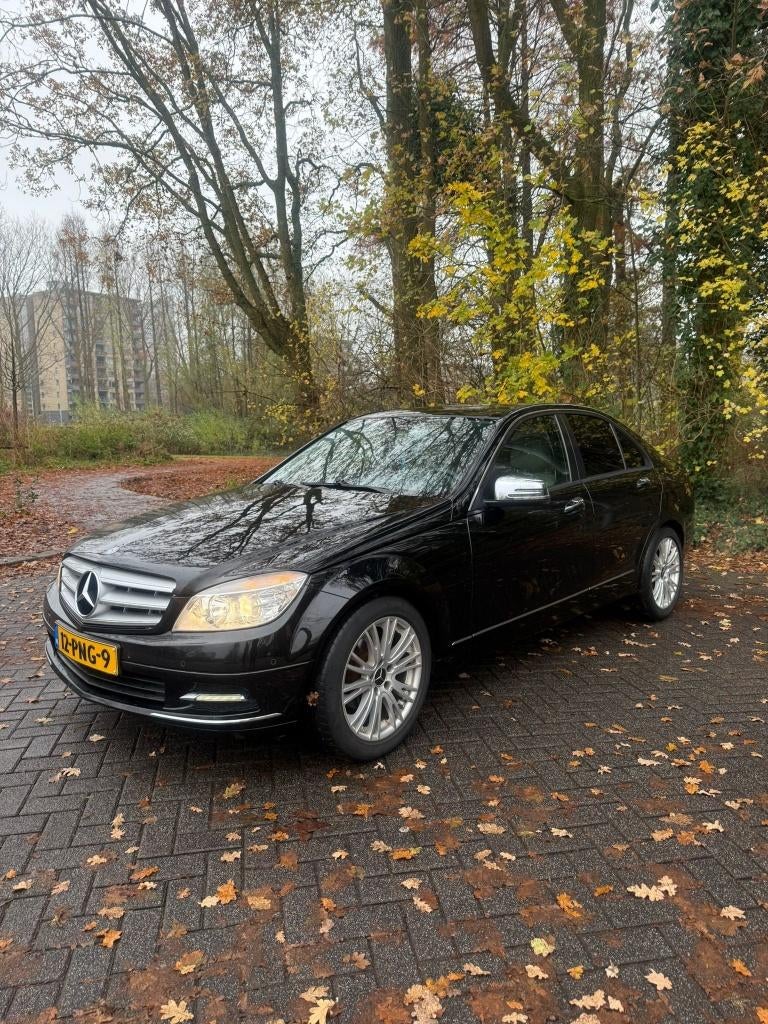 Mercedes-Benz C-Klasse 1.8 C180 CGI Sedan 2011 Zwart, Auto's, Mercedes-Benz, 1385 kg, Euro 5, 1800 kg, Beige