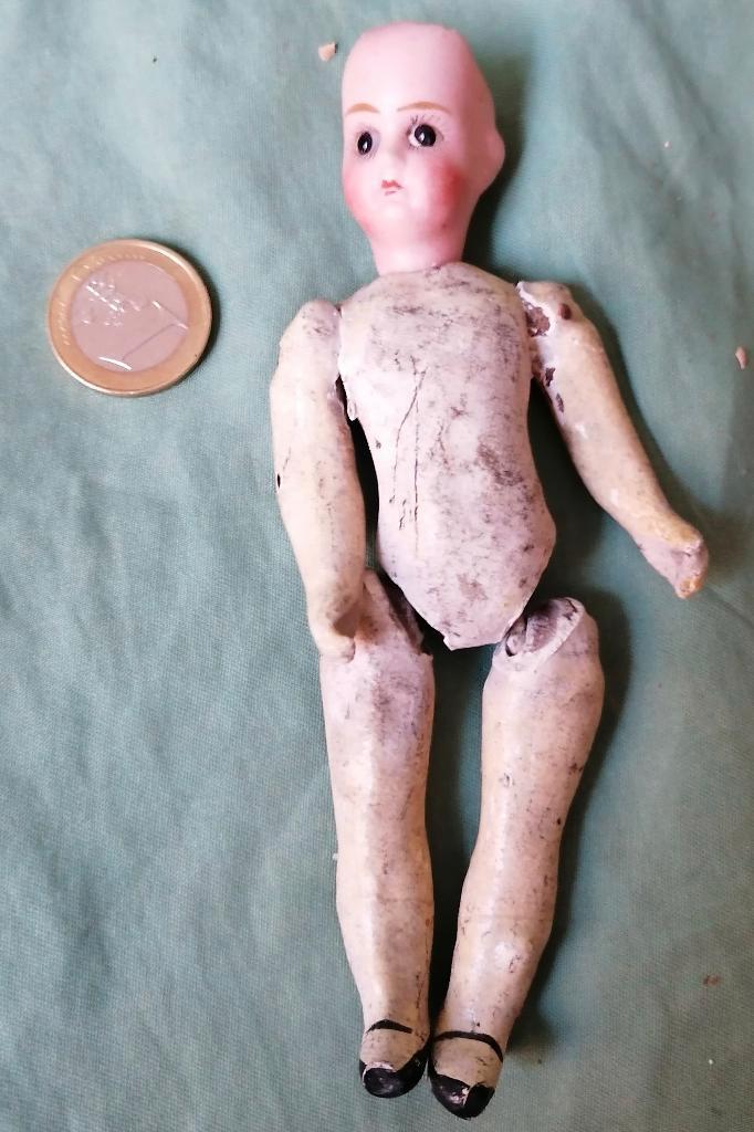 oud poppetje met porseleinen hoofd, Antiek en Kunst, Antiek | Speelgoed, Ophalen of Verzenden
