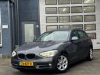 BMW 1-serie 114i Business+ | Airco | Cruise | Navi | Camera, 1-Serie, Achterwielaandrijving, Gebruikt, 4 cilinders