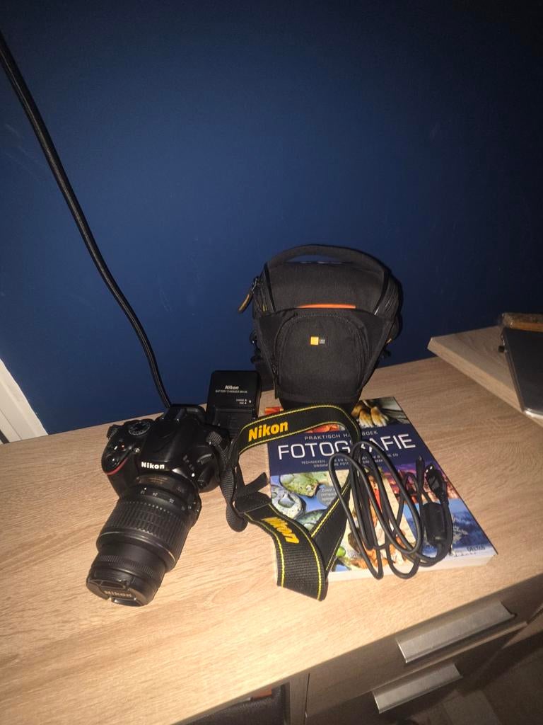 Nikon D5100 camera met tas en fotografie boek, Ophalen