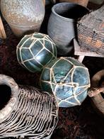 Oude groene glazen drijvers, Ophalen