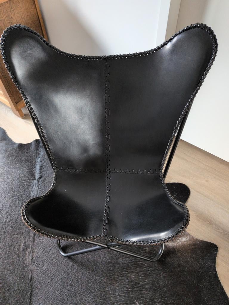 Vlinderstoel zwart leer, Ophalen