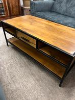 Mangohouten salontafel, Ophalen