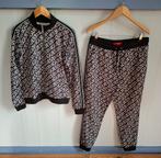 Mooi zwart/wit "Guess" dames trainingspak. Mt.L. Als nieuw!, Kleding | Dames, Guess, Zwart, Ophalen of Verzenden, Zo goed als nieuw