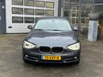 BMW 1-serie 114i Business+ | Airco | Cruise | Navi | Camera, 1-Serie, Achterwielaandrijving, Gebruikt, 4 cilinders