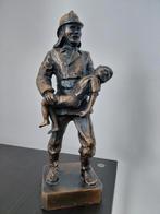 Bronzen beeld: Brandweerman redt kind, Ophalen