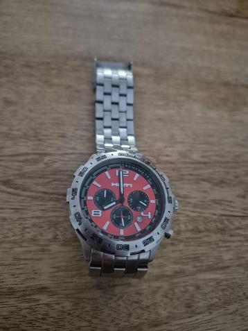 Heren Horloge stalen band met schakels en met rood klokje  beschikbaar voor biedingen