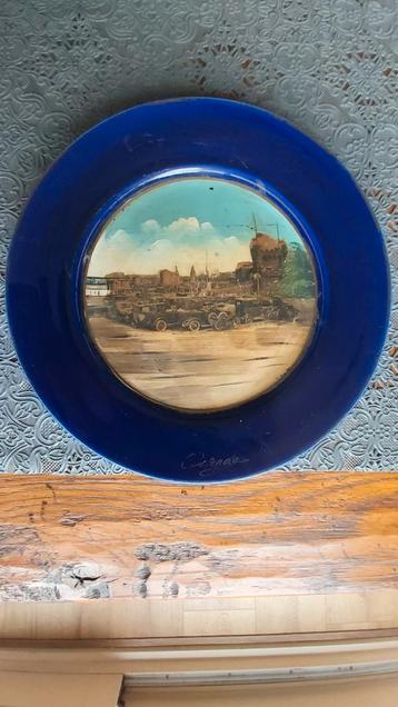 Te koop wandbord uit Oostende, jaren 1920 beschikbaar voor biedingen