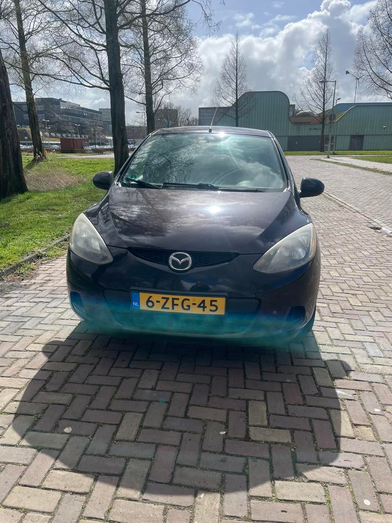 Mazda 2 1.3 63KW 5DRS 2009 Bruin 5 duers apk, Voorwielaandrijving, 4 cilinders, Bruin, 1349 cc