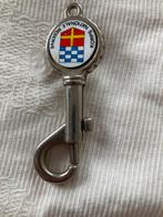 Korps Nationale Reserve sleutelhanger (Flesopener), Verzamelen, Militaria | Algemeen, Verzenden, Landmacht, Nederland, Overige typen
