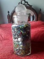 Stopfles vol knikkers, Ophalen