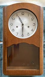 Slingerklok van Kienzle, Ophalen