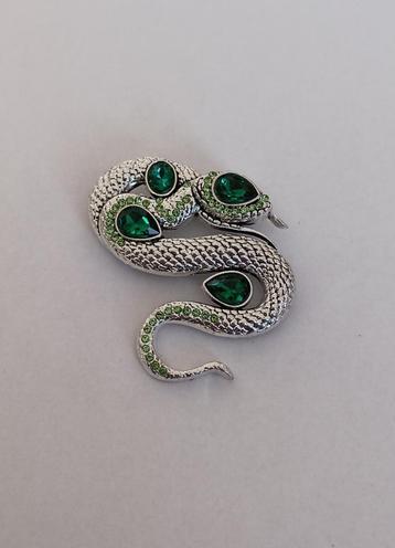 Slang broche beschikbaar voor biedingen
