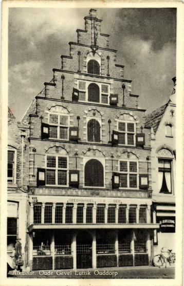 Alkmaar. Oude Gevel Luttik Ouddorp - vrouw fiets - 1962 gelo beschikbaar voor biedingen