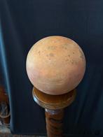 Terra cotta bal, Ophalen