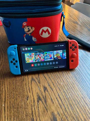 Nintendo Switch oled + 128gb ssd, 4 joy cons en veel extra’s beschikbaar voor biedingen