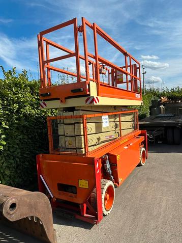 Te koop zeer nette Holland Lift Combistar N-140el12 bj 2005 beschikbaar voor biedingen