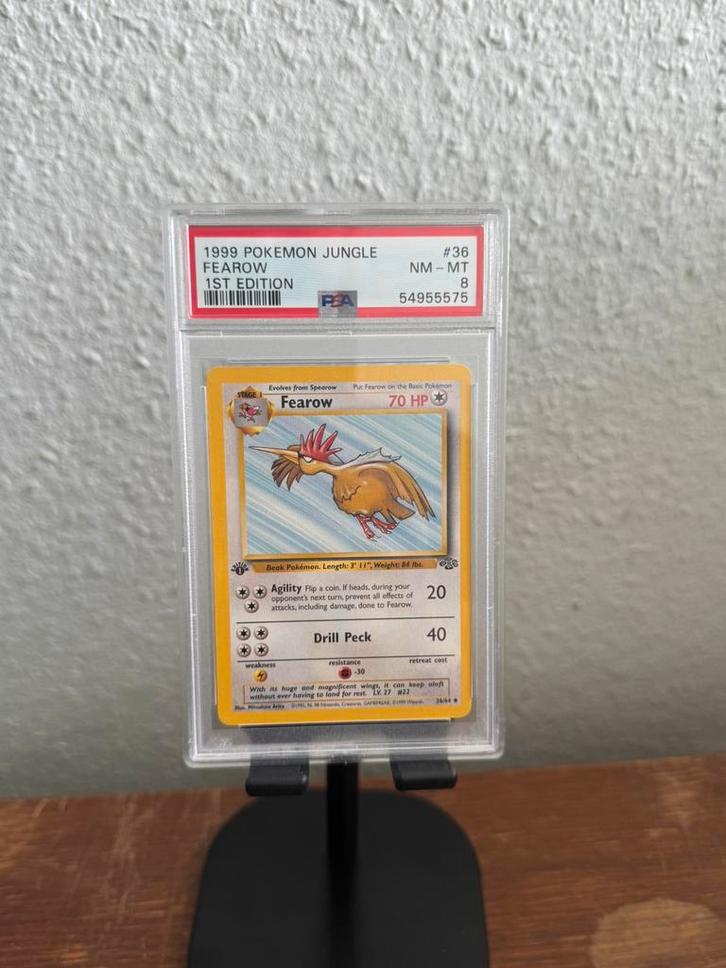 Fearow PSA 8 1st edition Jungle, Hobby en Vrije tijd, Verzamelkaartspellen | Pokémon, Zo goed als nieuw, Losse kaart, Ophalen of Verzenden
