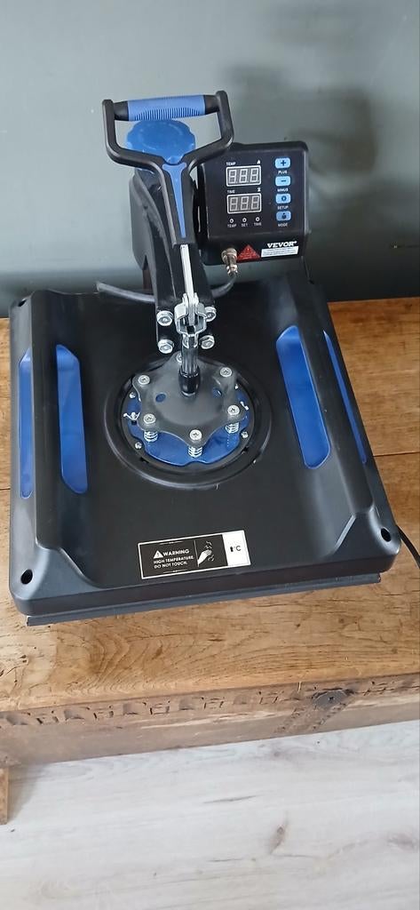 Kleding en mokken drukpers petten, Ophalen