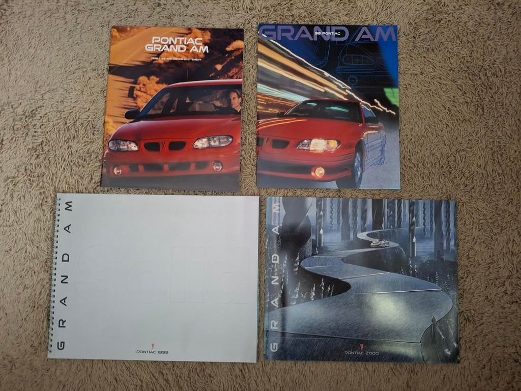 Lot autofolders Pontiac Grand Am, Verzenden, Zo goed als nieuw, Algemeen