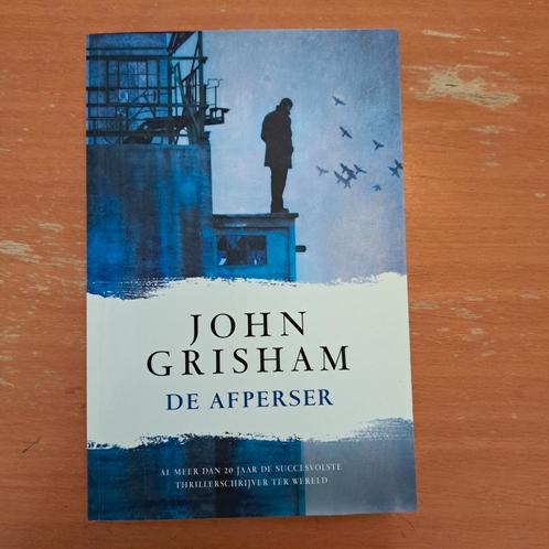 John Grisham - De afperser, Boeken, Thrillers, Zo goed als nieuw, Nederland, Ophalen of Verzenden