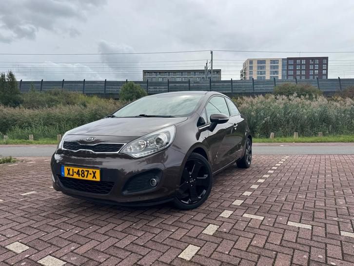 Kia Rio 1.2 I 3DRS 2012 Bruin | zuinig, schadevrij |APK 2026, Auto's, Kia, Particulier, Rio, Airbags, Airconditioning, Alarm, Bluetooth