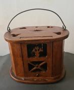 Oude houten voetkachel, Ophalen