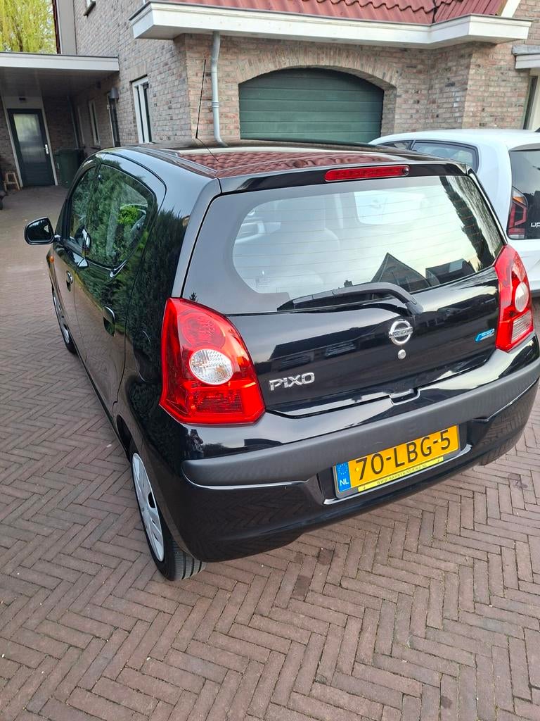 Nissan Pixo 1.0 50KW 5D 2010 Zwart, Auto's, Nissan, Particulier, Pixo, Airbags, Airconditioning, Centrale vergrendeling, Benzine