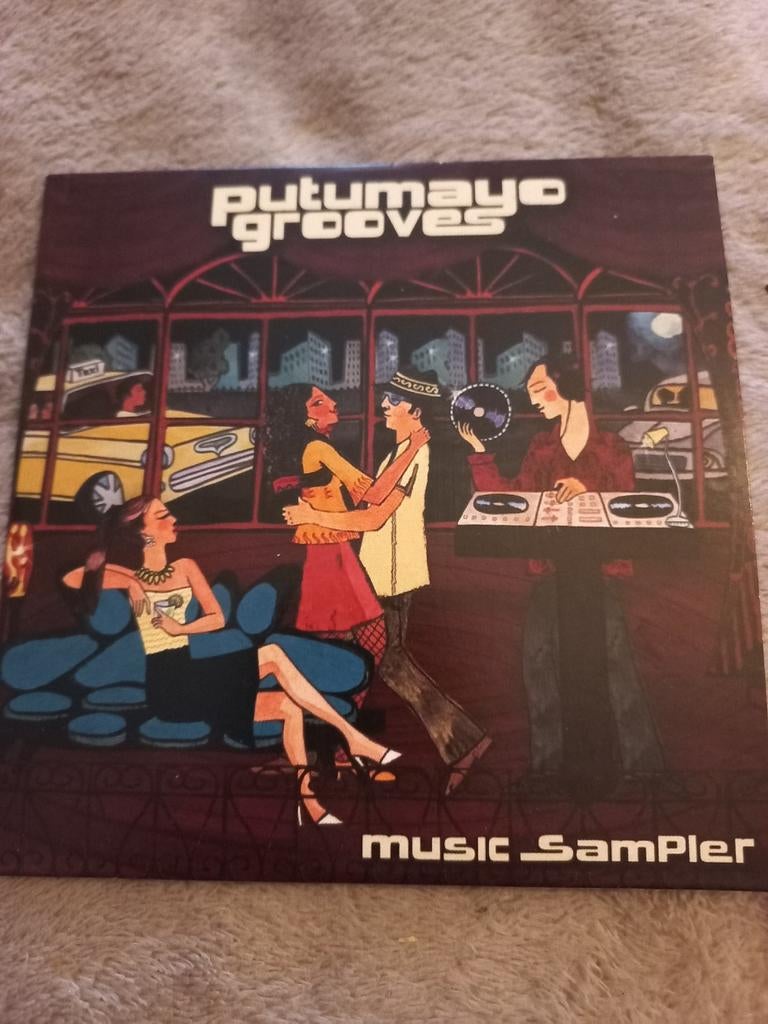 Putumayo Grooves Music Sampler CD, Ophalen of Verzenden, Zo goed als nieuw