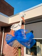 Ooievaar met mand, Ophalen